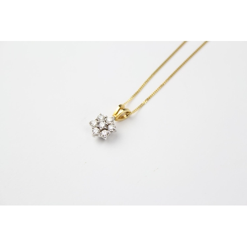 108 - A ladies cluster diamond necklace, on a gold chain.