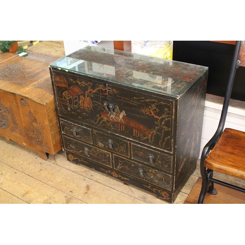 509 - An Edo period black lacquered Chinese decorated cupboard.