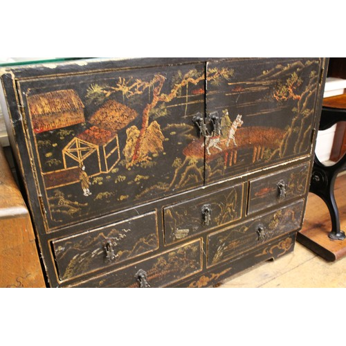 509 - An Edo period black lacquered Chinese decorated cupboard.