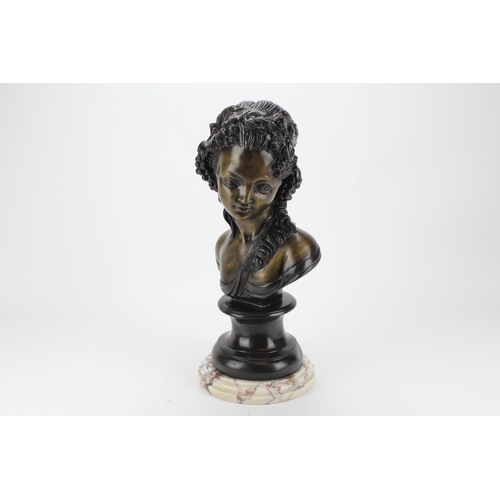 665 - A bronzed bust of a young girl, resting on a marble effect base.