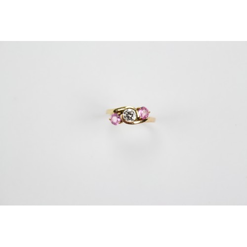 109 - A Ladies Diamond & Sapphire crossover Ring set in a Gold Mount in Original Box. Size: L.