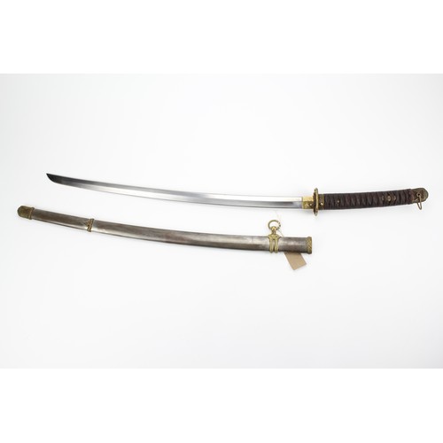 525 - A Japanese World War II Katana, in a steel and brass mounted sheath.