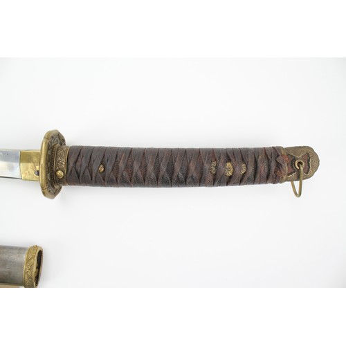 525 - A Japanese World War II Katana, in a steel and brass mounted sheath.