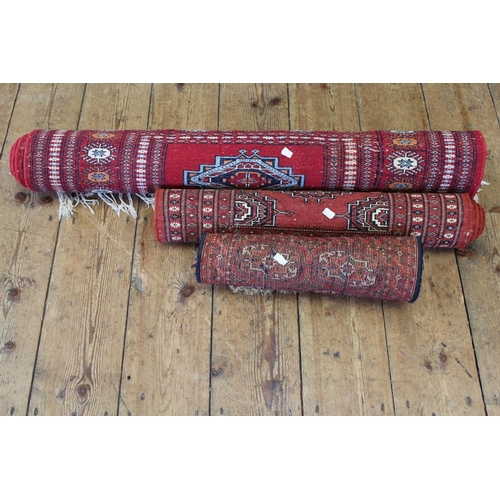 539 - Three various Pakistani and Turkish red rugs.