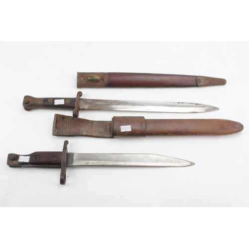 650 - A second world war bayonet, along with another in metal scabbard.