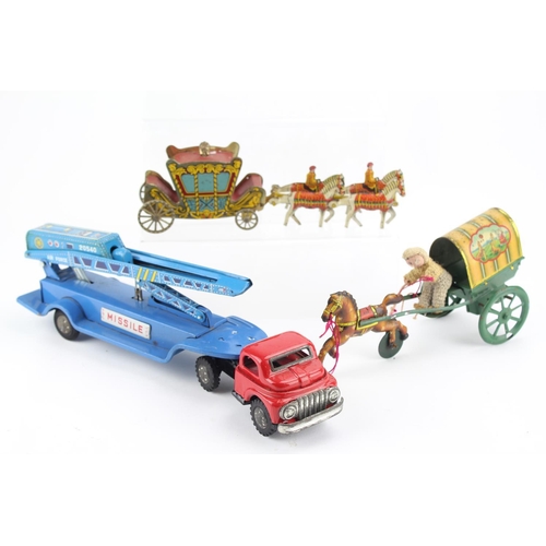 900 - 3 x Tin Plate Toys to include a Coach & Horses, a Clockwork Coach, Rider & Horse & a Missile Launche... 