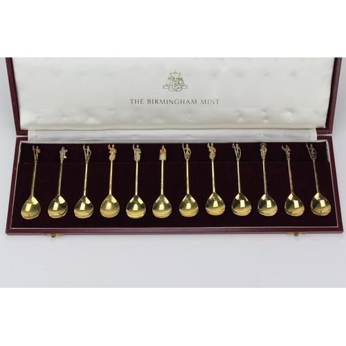 64A - The Birmingham Mint set of 12 apostle spoons, in silver gilt & the saints names in original case.