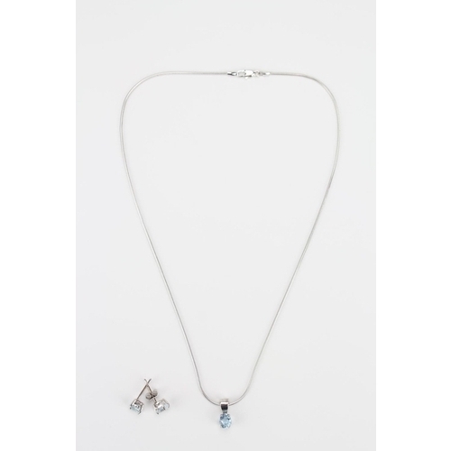 84 - A 9 carat white gold necklace, along with a pair of similar earrings set with blue zircon.