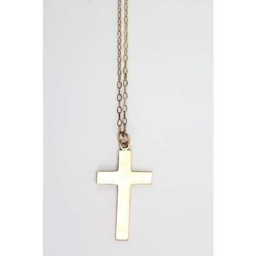 115 - A ladies plain 9 carat gold cross, on chain.