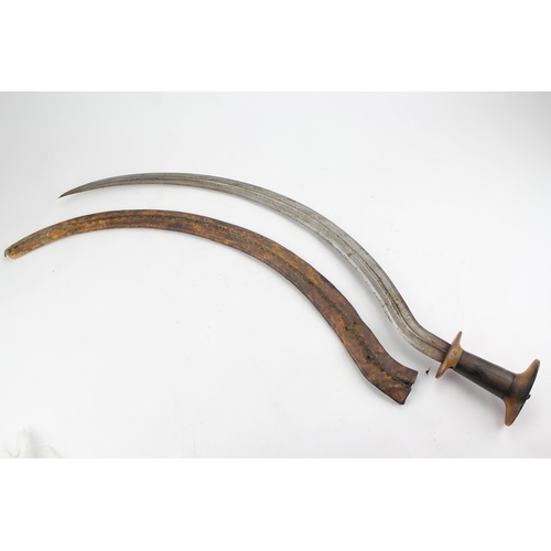 653 - An Arabic sword, with horn handle and leather scabbard.