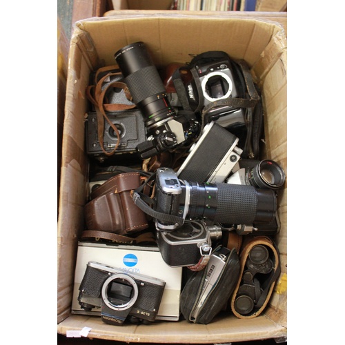 698 - An interesting collection of various camera equipment, including lenses and cases etc.