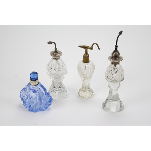 63 - Two large silver mounted atomisers, one base metal and cut glass silver mounted scent bottle.