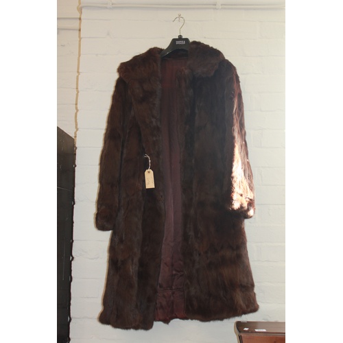 609A - A ladies Full length Russian brown mink coat with wide lapels.