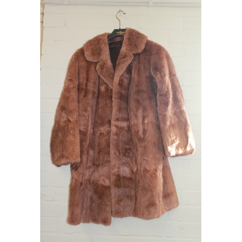 609B - A ladies three quarter length musk-wash fur coat and one other fur coat.