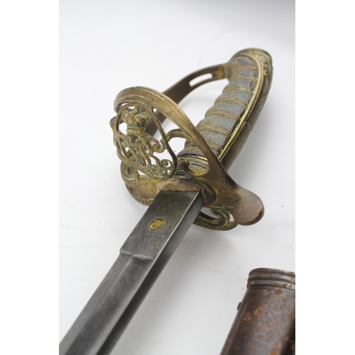 643 - A 19th century cavalry dress sword, decorated with a swirl pattern guard, insignia and crown, metal ... 