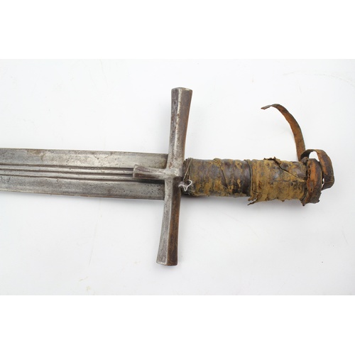 651 - A viking designed sword, decorated with gauges and leather covered pommel.