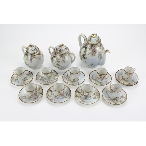 516 - A Japanese eggshell floral decorated tea set.