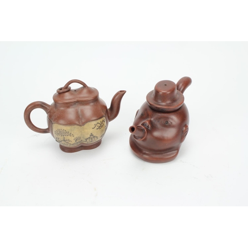 220 - Two Chinese tea pots one decorated in red earthen ware designed as man smoking plus one other shaped... 