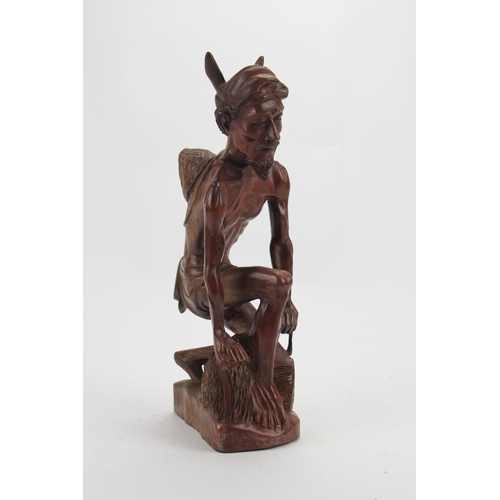 178 - A Scarce Bali School Carving of a study of a fisherman. Measuring: 15 inches High.