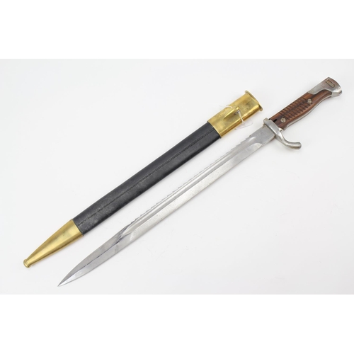 497 - A Brass and Steel military bayonet in case.