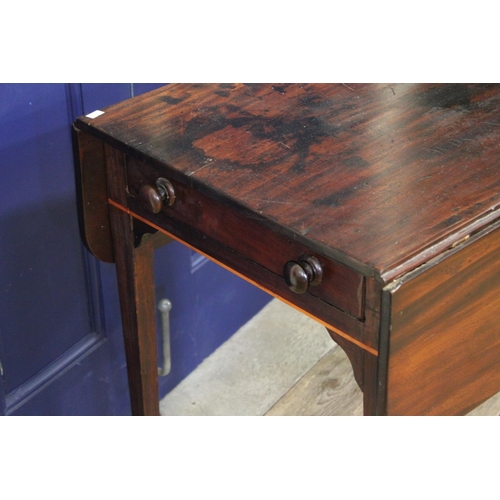 319 - A Georgian drop flap Mahogany Pembroke table fitted drawer on square legs.