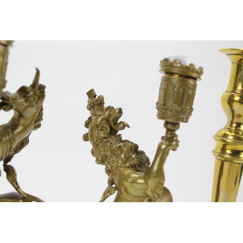 523 - A Pair Late 19th century cast brass French candle sticks designed as the Rouen Lion & a pair of bras... 