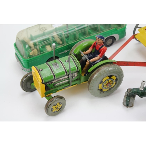 21 - A Scarce Mettoy Tractor & Hay rake with Original Driver along with a Plastic Mettoy Coach & 2 other ... 