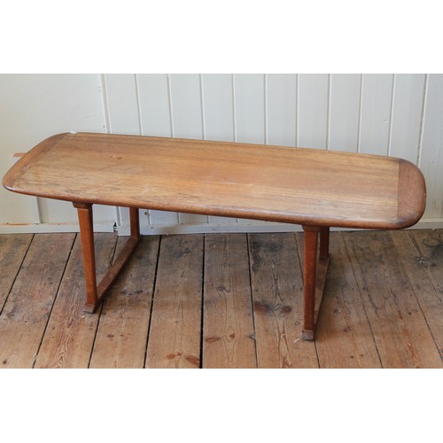 348 - A long John Oak coffee table, resting on square legs. Measuring 120cms Long x 45cms across x 39cms H... 