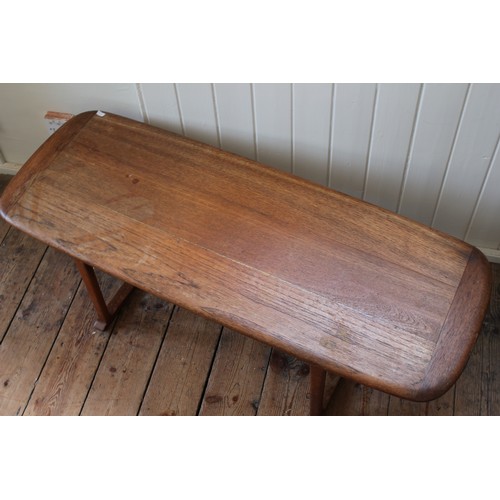 348 - A long John Oak coffee table, resting on square legs. Measuring 120cms Long x 45cms across x 39cms H... 