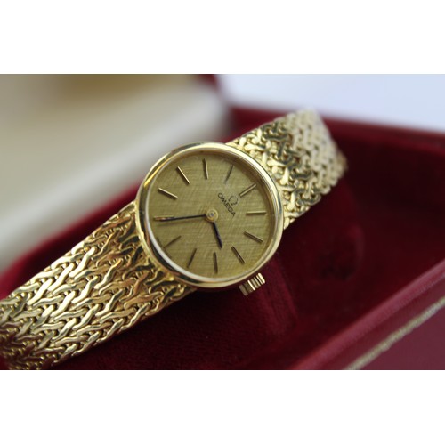 123 - A Lady's Lovely 9ct gold Omega wristwatch on a milanese strap in Original Box with Paperwork.