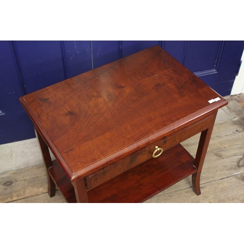 363 - A single drawer mahogany table on swept out legs.