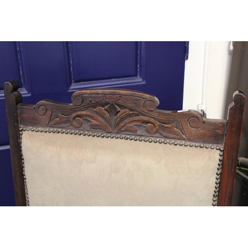 364 - A pair of Victorian ladies and gentleman open armed fire side chairs with carved backs & turned legs... 