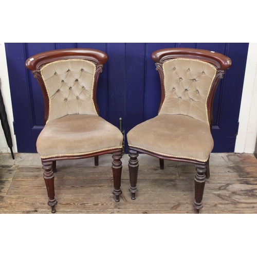 365 - A pair of Victorian Mahogany button backed dining chairs with shaped rail and turned legs.