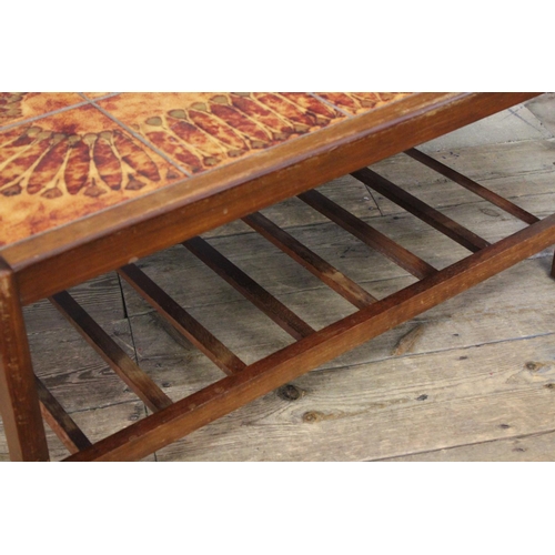 367 - A Scarce 1960's Tile Top table decorated in brown with a floral design.