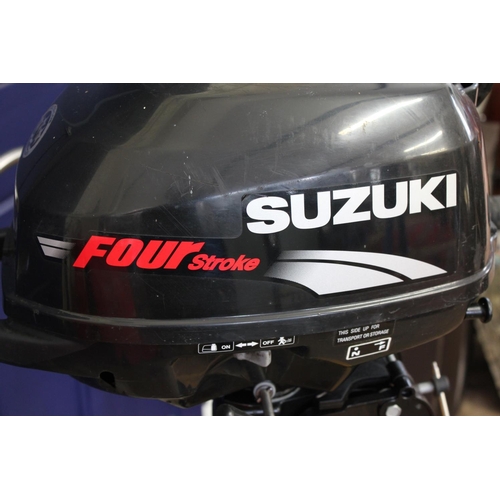 554 - A Suzuki 2.5hp Four Stroke Outboard Motor in Excellent Working condition. (Please Note: Stand Not in... 