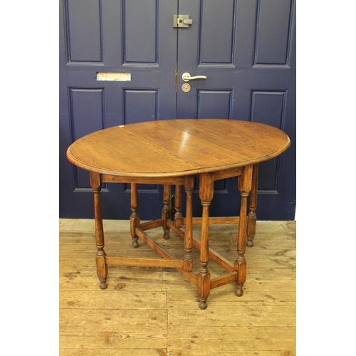 369 - A 1930's Oval Gate legged table. Measurement: 46 inches  x 45 inches across x 30 inches high. (Exten... 