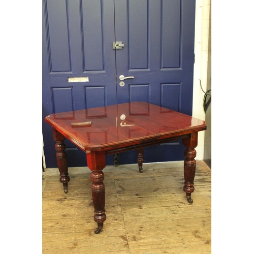 373 - A Large Extending Dining Room Table with an extending leaf & Original Handle on carved legs & castor... 