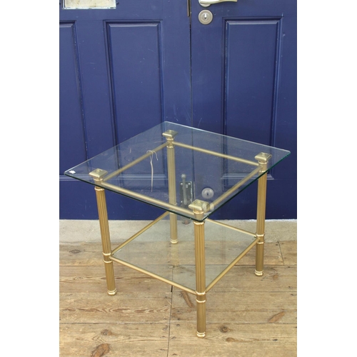 374 - A 1980's Brass effect & Glass Coffee Table resting on Column supports. Measuring: 22 x 22 inches.