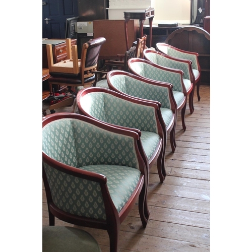 395 - A Set of Six Blue Raylon Covered Bow Designed Dining Chairs on Shaked Legs.