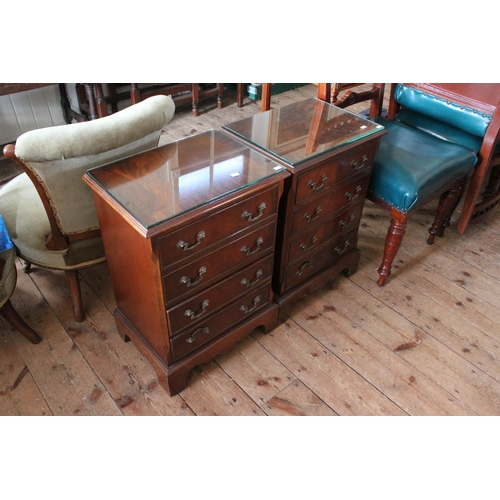 396 - A pair of side tables with 4 drawers and glass tops. Measuring: 17.5 inches across x 13 inches deep ... 