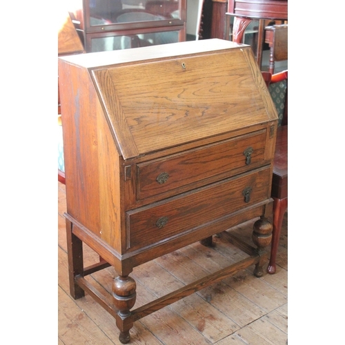 399 - A Oak Bureau Fitted with 2 Drawers on Tudor Legs.