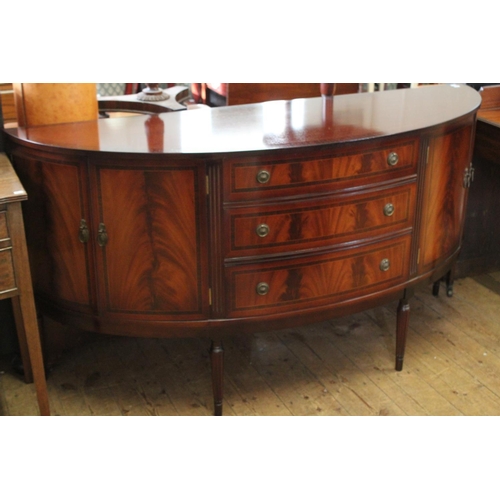 406 - A Reproduction Mahogany Bow Fronted Side Board, Flame Veneered Fitted Drawers and Cupboards.