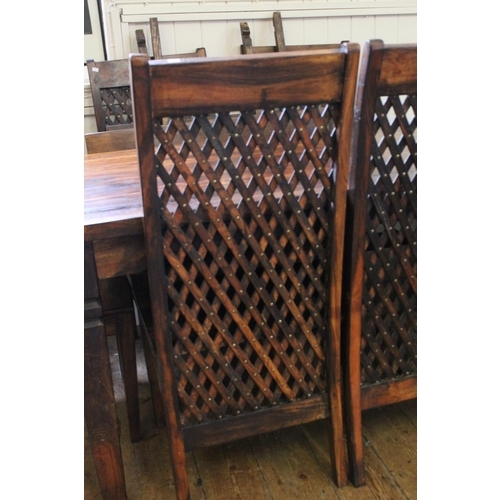 411 - A Lovely Dark Wood Extendable Dining Room Table along with 6 matching Chairs.