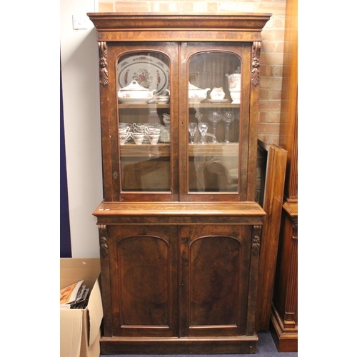 416 - A Victorian Mahogany Book Case with Fitted Glazed Top Panel Door and Carved Decoration.