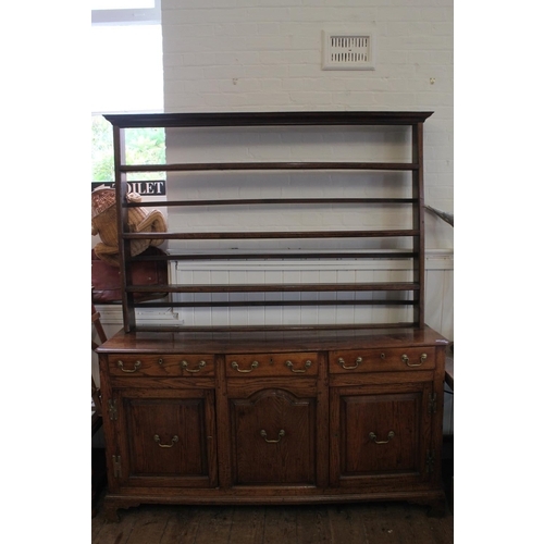 424 - An Antique Welsh Oak Patterned Three Drawers Dresser with Brass Handles with Open Back Plate Rack & ... 