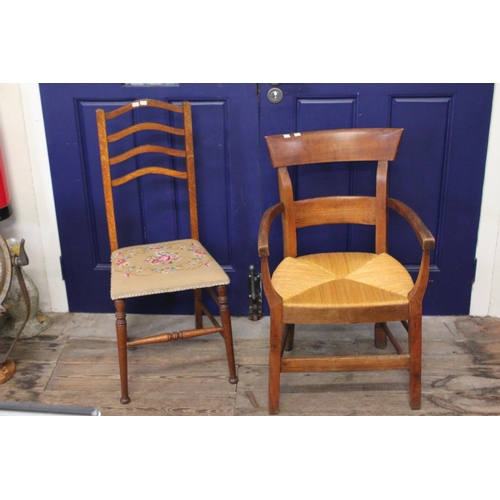 432 - An English design Bow shaped Arts & Crafts Rush Seat Elbow Chair along with another Chair with a Tap... 