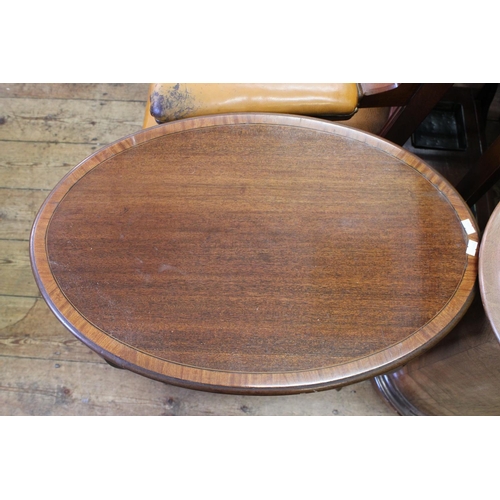 448 - An Edwardian Mahogany Oval Shaped Occasional Table resting on Shaped Legs & Under Tier. Measuring: 2... 