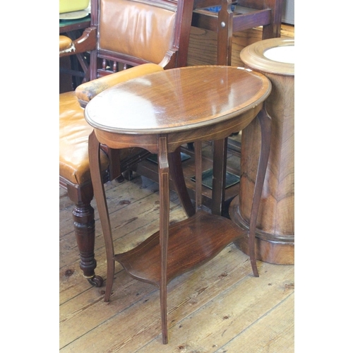 448 - An Edwardian Mahogany Oval Shaped Occasional Table resting on Shaped Legs & Under Tier. Measuring: 2... 