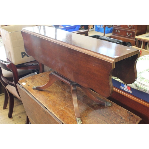 449 - A Modern Walnut Finished Drop Flap Coffee Table resting on a Tripod Base.