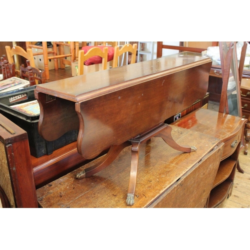 449 - A Modern Walnut Finished Drop Flap Coffee Table resting on a Tripod Base.